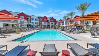 Our apartments have a swimming pool with lounge chairs and umbrellas